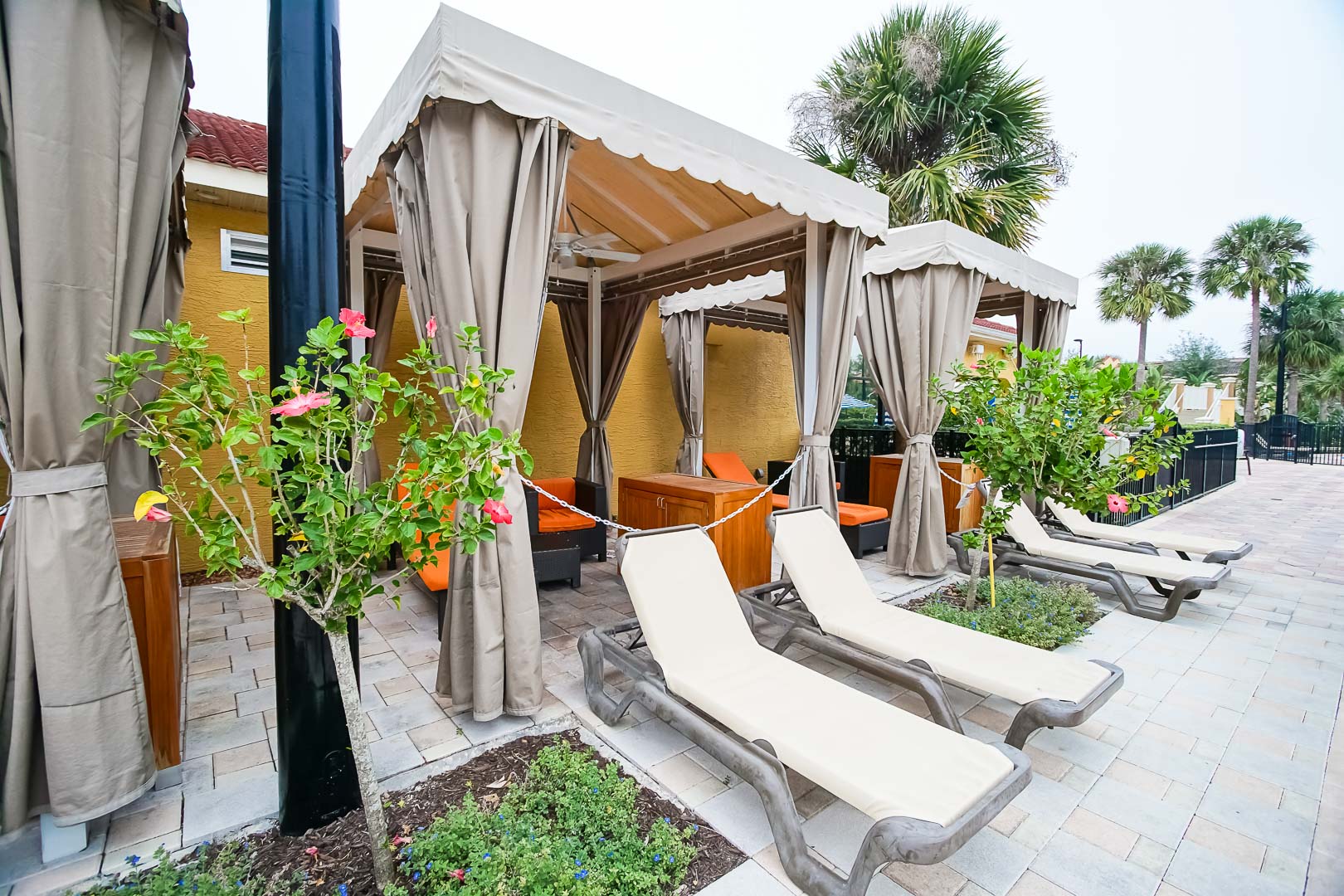 A modern pool lounging area at VRI's Fantasy World Resort in Florida.